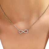 Witgoudkleurige ketting met oneindigheidshanger en zirkonia