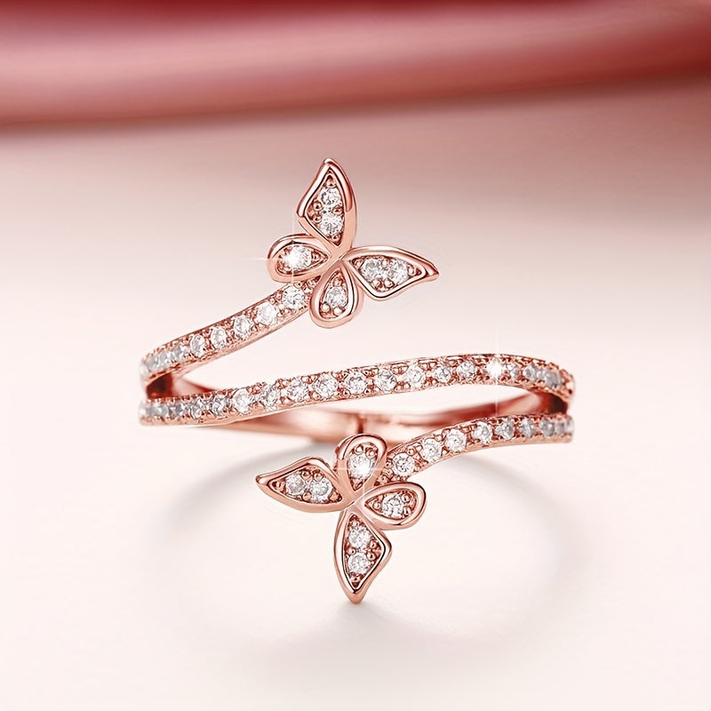 Witgoudkleurige ring met vlinders en ingezette zirkonia