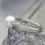 Fijne ring met parels en kristallen
