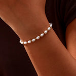 Elegante armband van parelmoer en goud