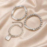 Set witgouden armbanden met parels en punksluiting