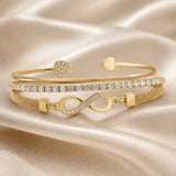Set witgouden armbanden met strass en oneindigheidssymbool