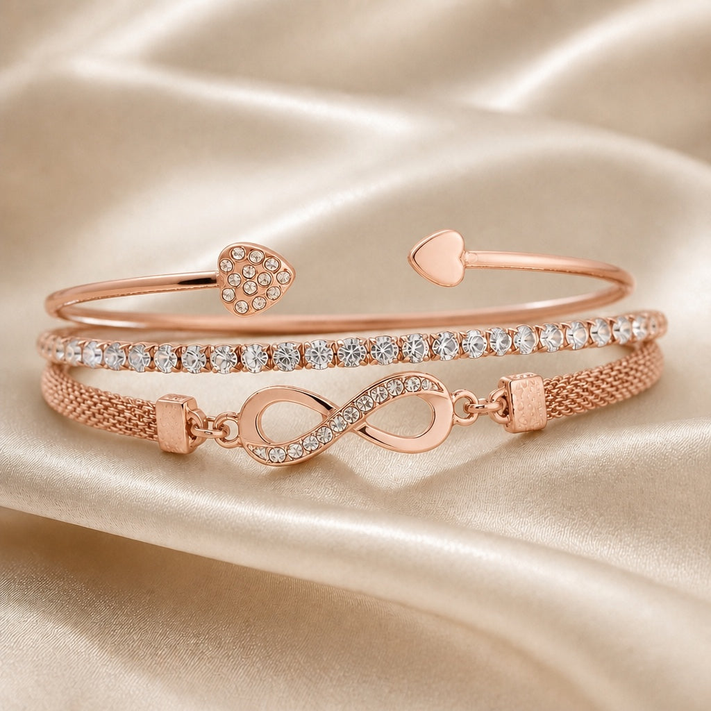 Set witgouden armbanden met strass en oneindigheidssymbool