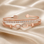 Set witgouden armbanden met strass en oneindigheidssymbool