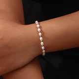 Elegante armband van parelmoer en goud