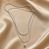 Dubbele witgouden ketting met druppelhanger