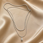 Dubbele witgouden ketting met druppelhanger