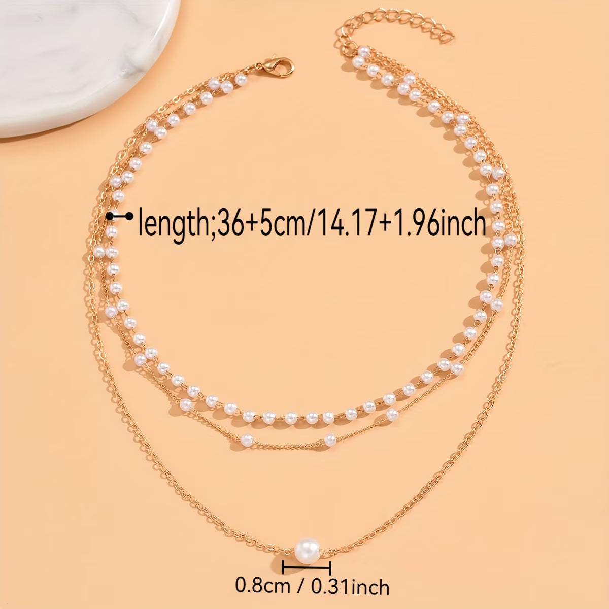 Driedubbele ketting met lagen parels