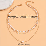Driedubbele ketting met lagen parels