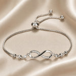 Verstelbare witgoudkleurige armband met oneindigheidssymbool