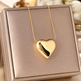 Elegante witgoudkleurige ketting met bol hart