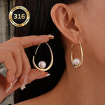 Oorbellen met hangende parels