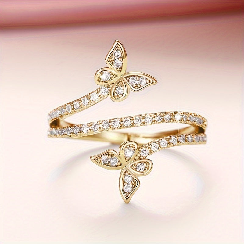 Witgoudkleurige ring met vlinders en ingezette zirkonia