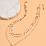 Driedubbele ketting met lagen parels