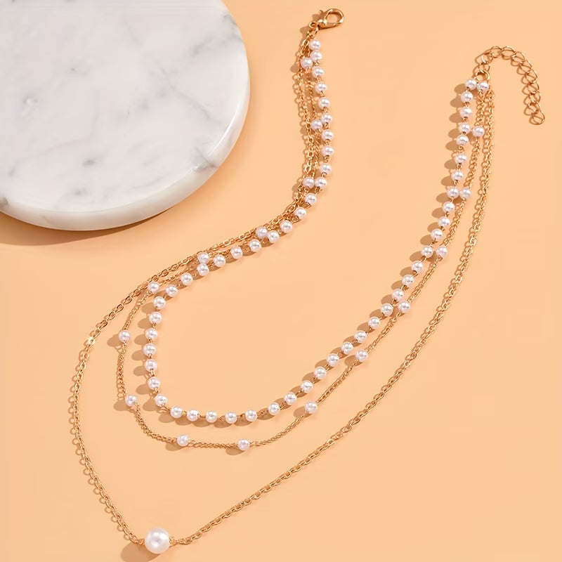 Driedubbele ketting met lagen parels