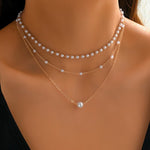 Driedubbele ketting met lagen parels