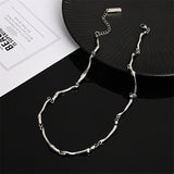 Witgouden ketting met golvend vlechtwerk