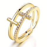 Gelaagde witgouden ring met kruis en zirkonia