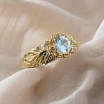 Gouden ring met blad en zirkonia