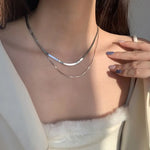 Gelaagde witgouden ketting met slangen