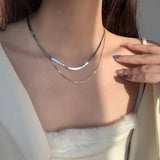 Gelaagde witgouden ketting met slangen