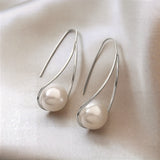 Elegante oorbellen met mysterieuze parel