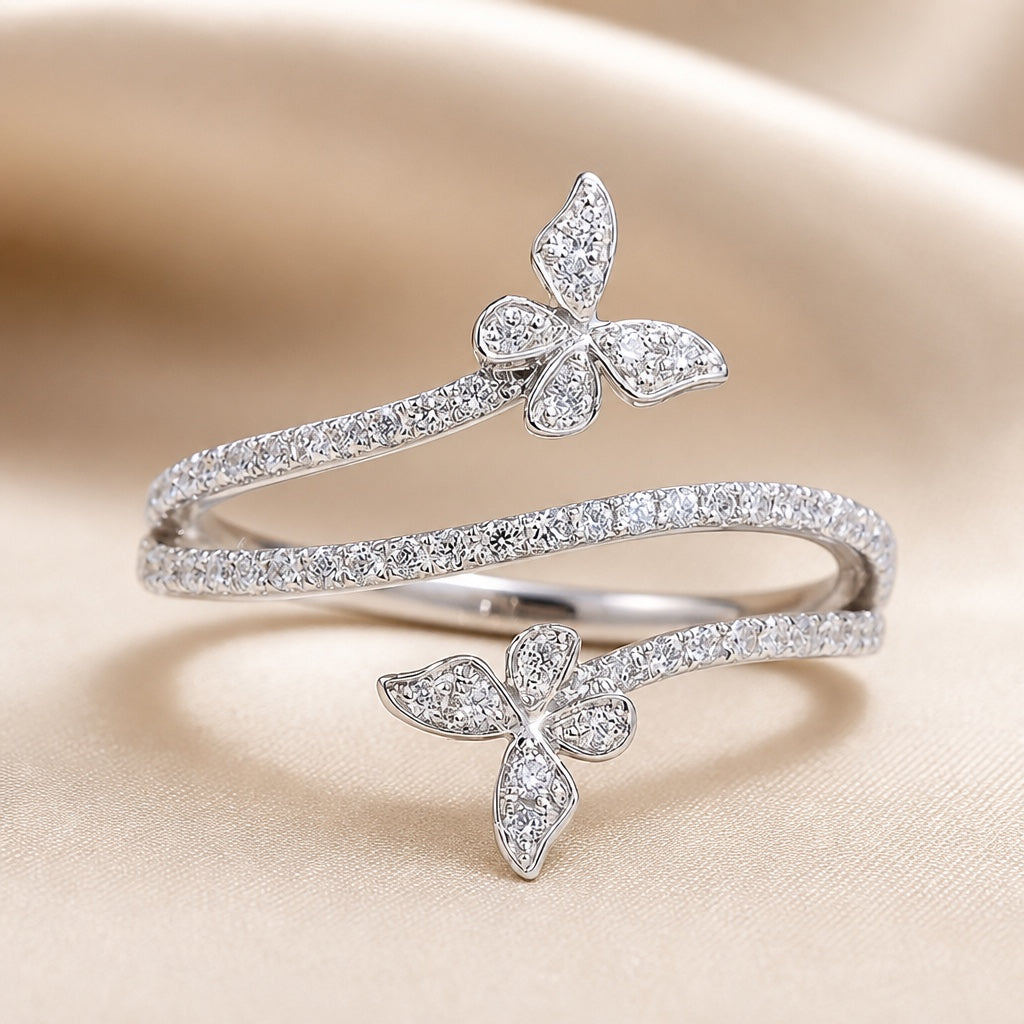 Witgoudkleurige ring met vlinders en ingezette zirkonia