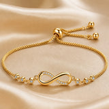Verstelbare witgoudkleurige armband met oneindigheidssymbool