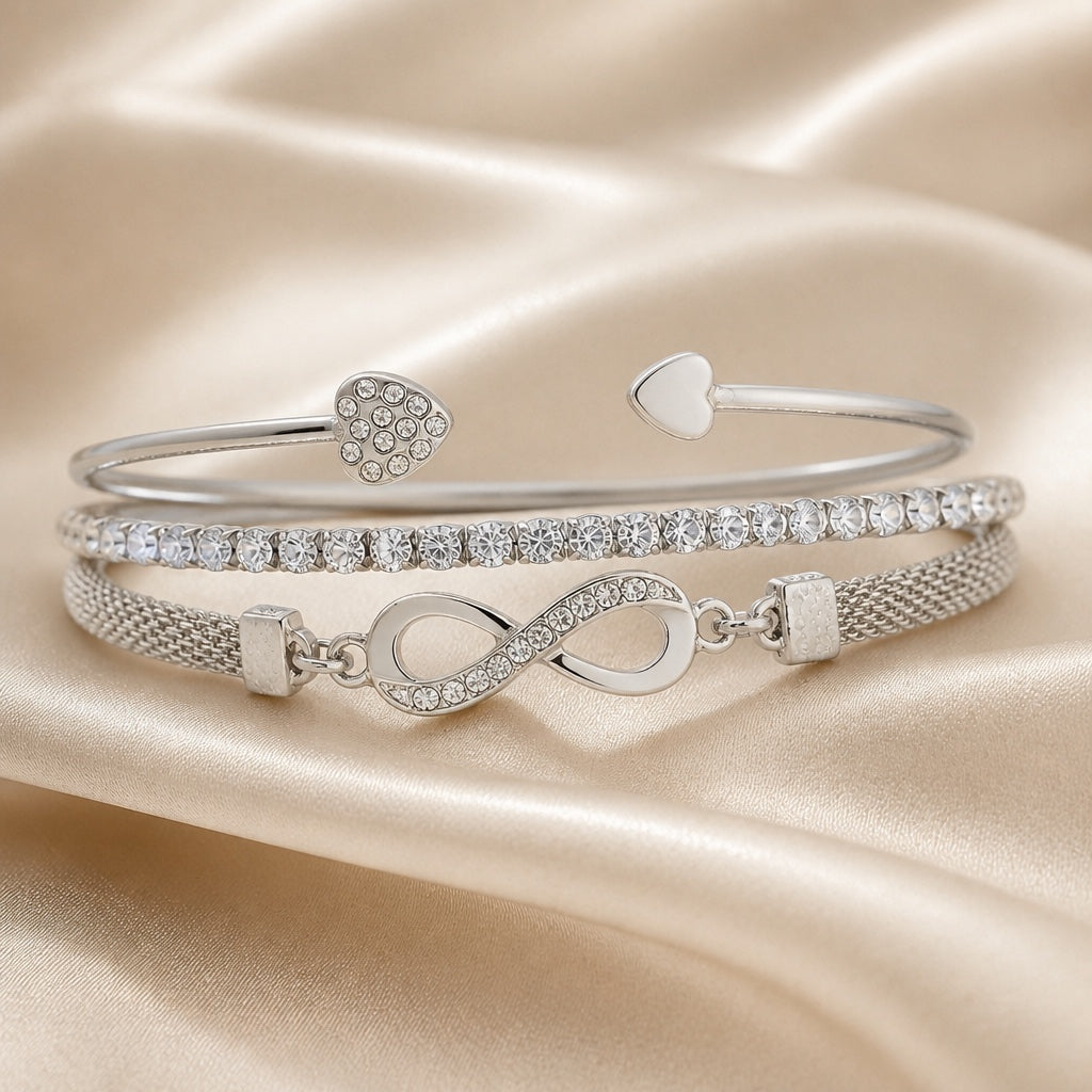 Set witgouden armbanden met strass en oneindigheidssymbool