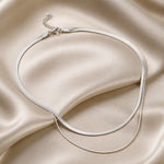 Gelaagde witgouden ketting met slangen