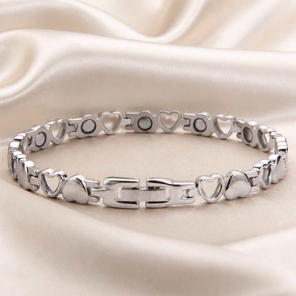 Verfijnde witgoudkleurige armband met harthanger