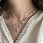 Dubbele witgouden ketting met druppelhanger