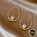 Oorbellen met hangende parels