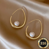 Oorbellen met hangende parels