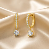 Witgouden oorbellen met rondgeslepen moissaniet