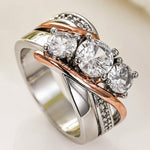 Goud- en zilverkleurige ring met sculpturaal ontwerp en zirkonia